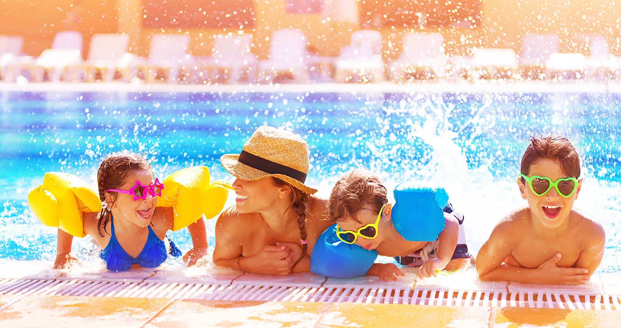 Family having fun in swimming pool
